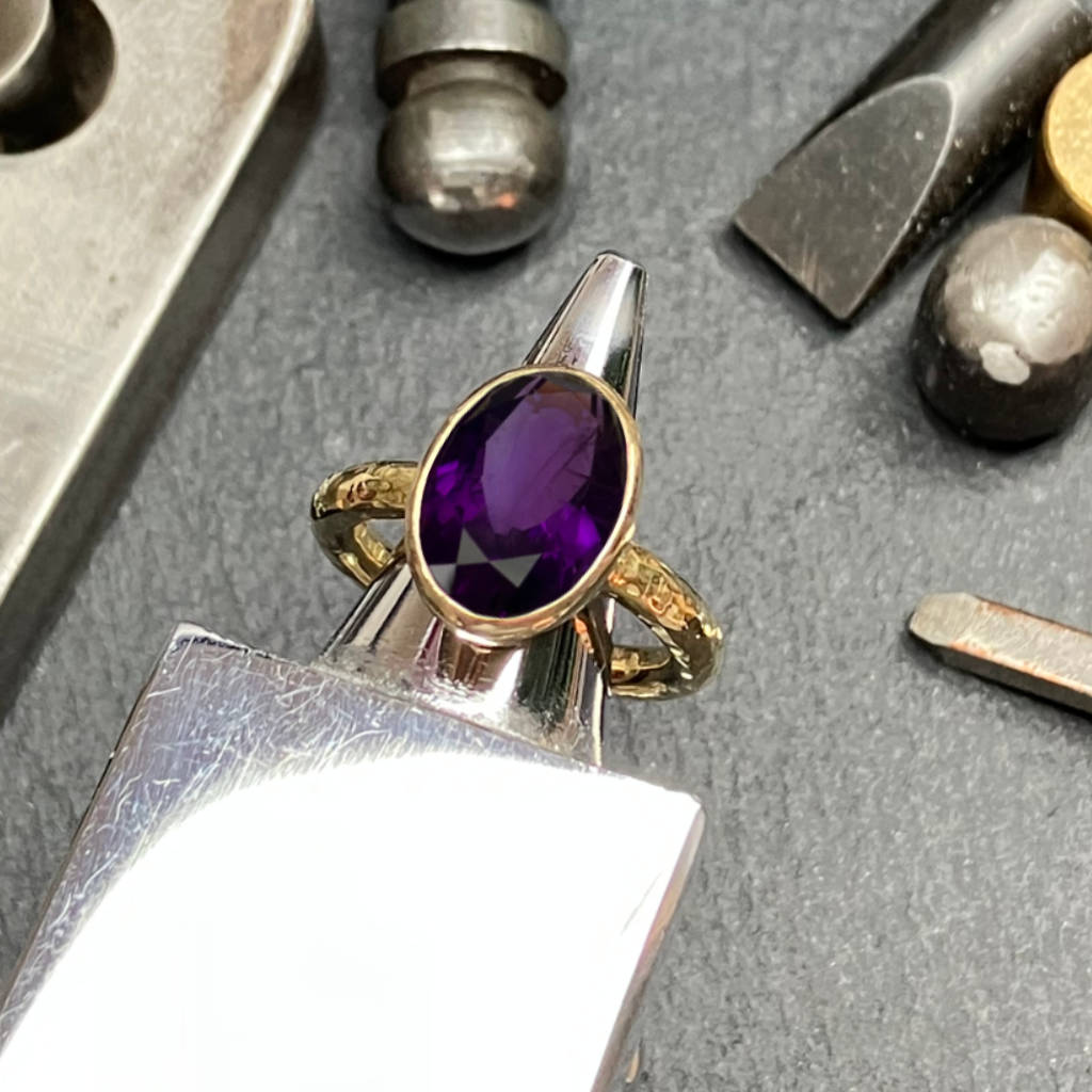 Amanda Cox 18ct gold vermeil amethyst ring on her workbench in Heptonstall