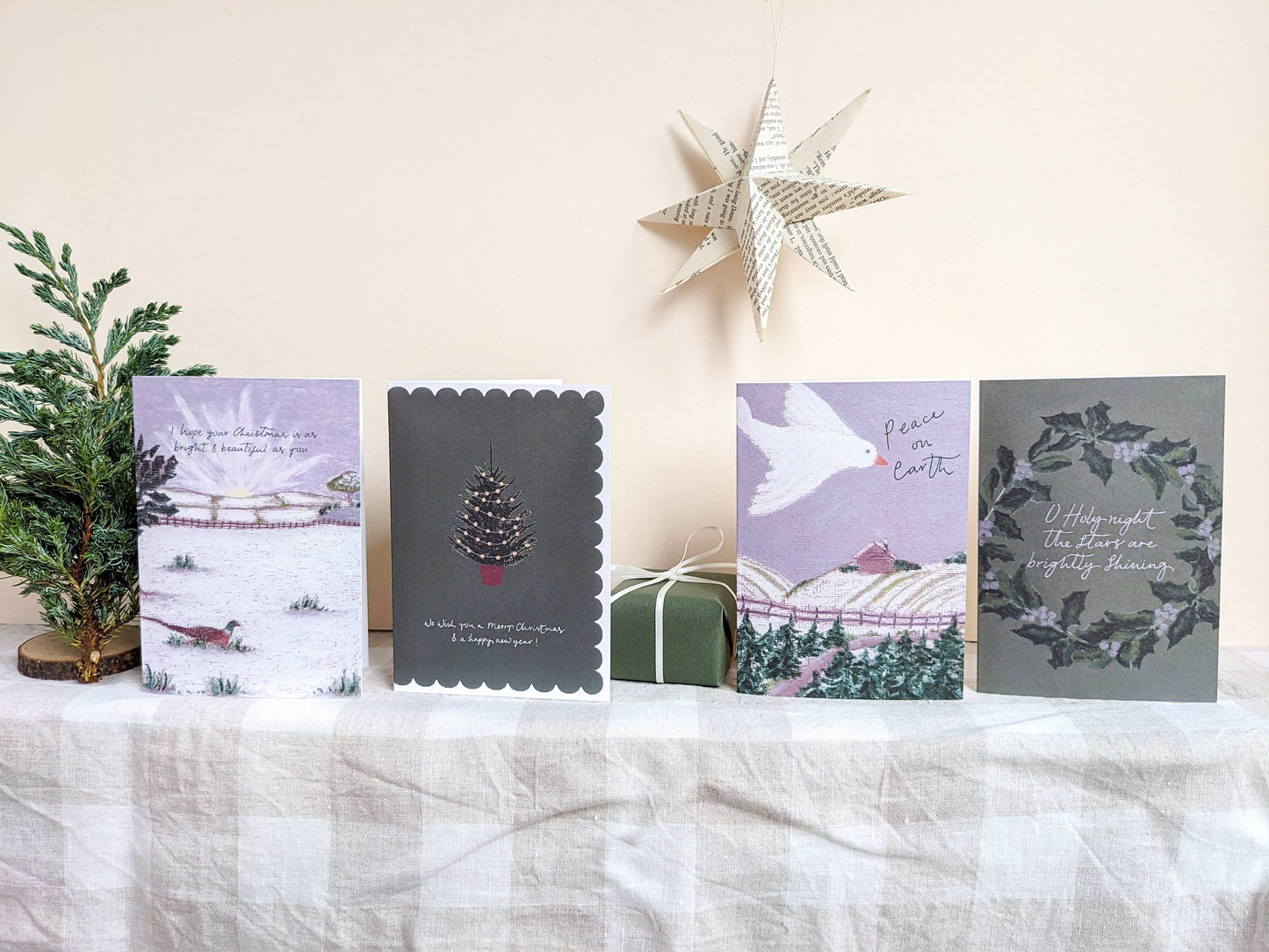 Set of Christmas cards on a white surface with decorative elements.