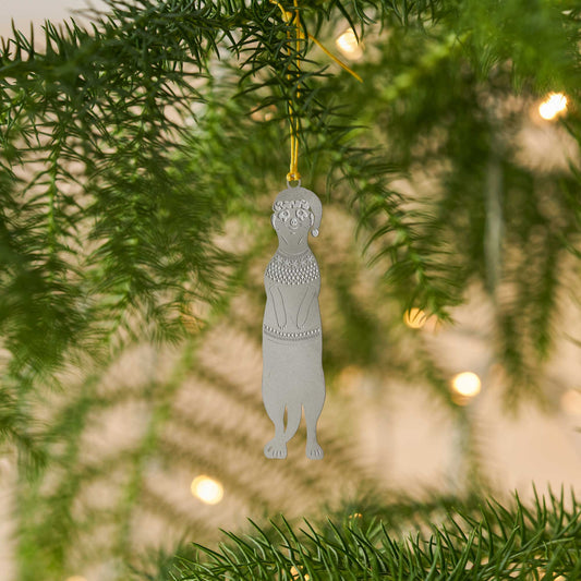 A stainless steel meerkat Christmas jumper decoration with a festive color cord hanging in a Christmas Tree by Another Studio for Heart Gallery