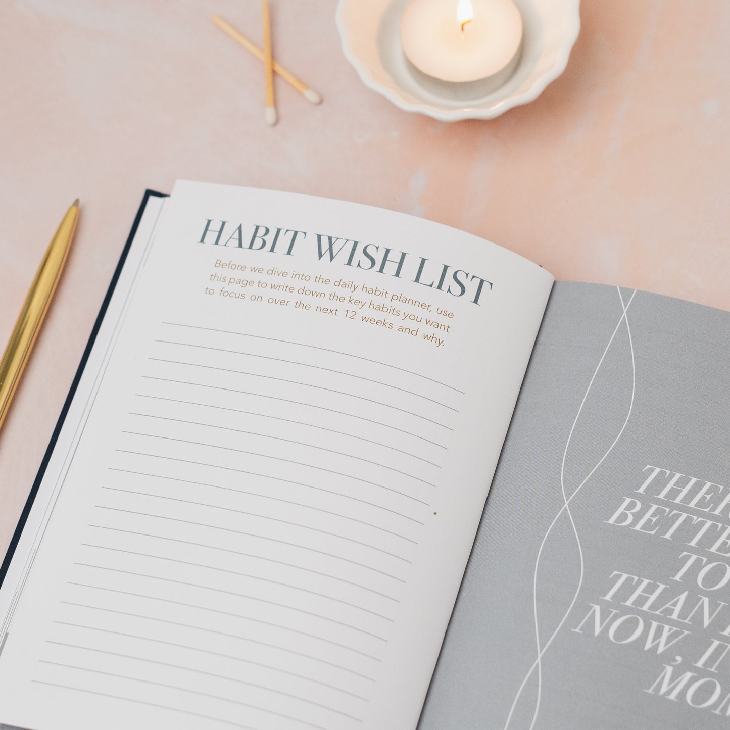 Open notebook with 'Habit Wish List' on a light pink surface with candles and pencils. LSW Journal for Heart Gallery