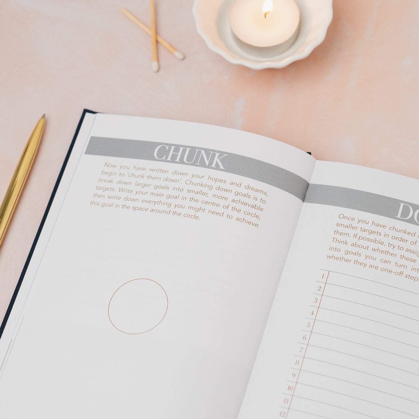 Open notebook with a page titled 'Chunk' on a light surface with a candle and pencils. LSW Habit Notes journal for Heart Gallery