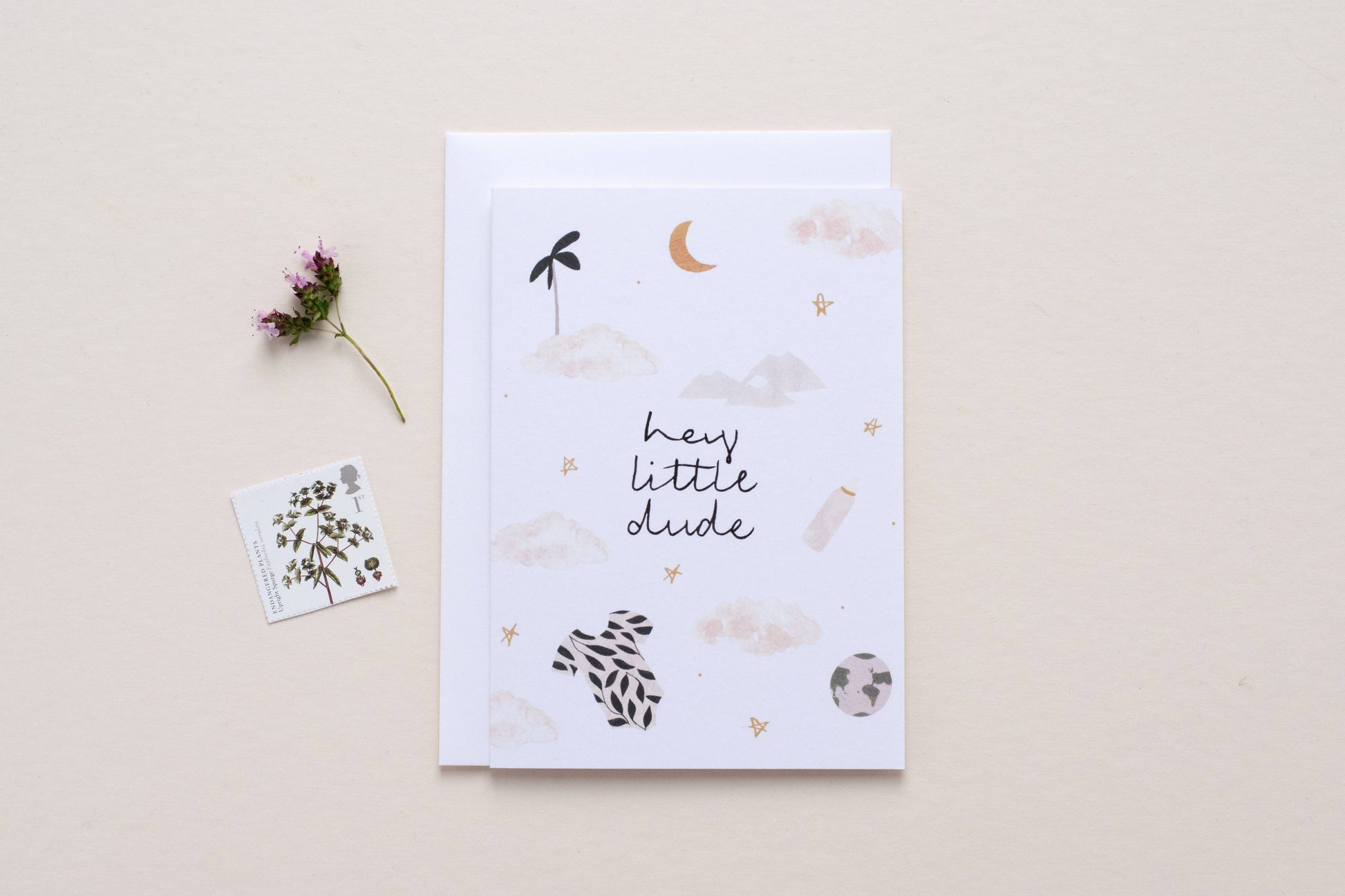 Greeting card with decorative elements and text on a beige background Hey Little Dude