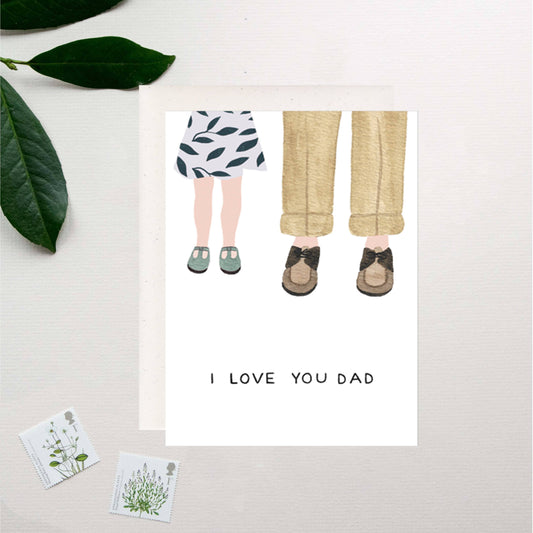Illustration of a child and adult legs with 'I LOVE YOU DAD' text on a white background.