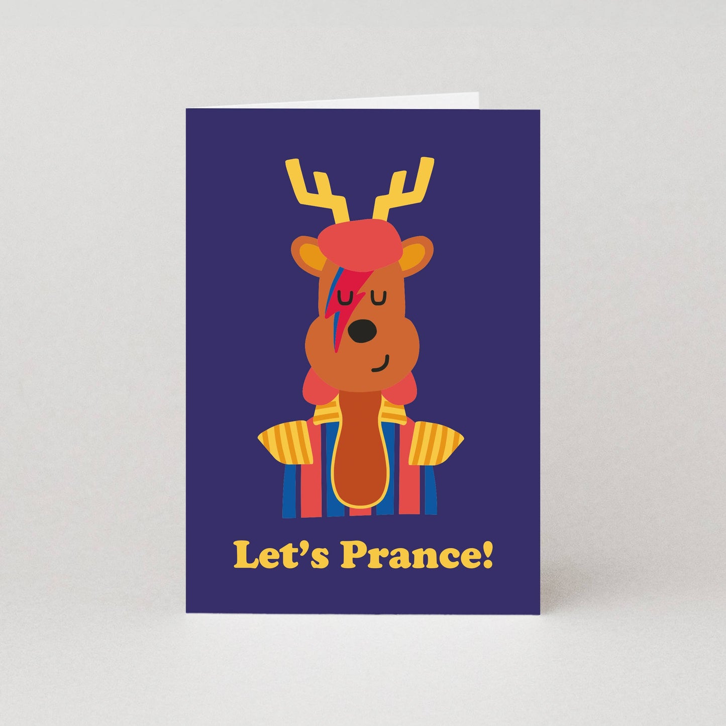 Card with a cartoon reindeer wearing a hat and scarf, and the text 'Let's Prance!' on a purple background.