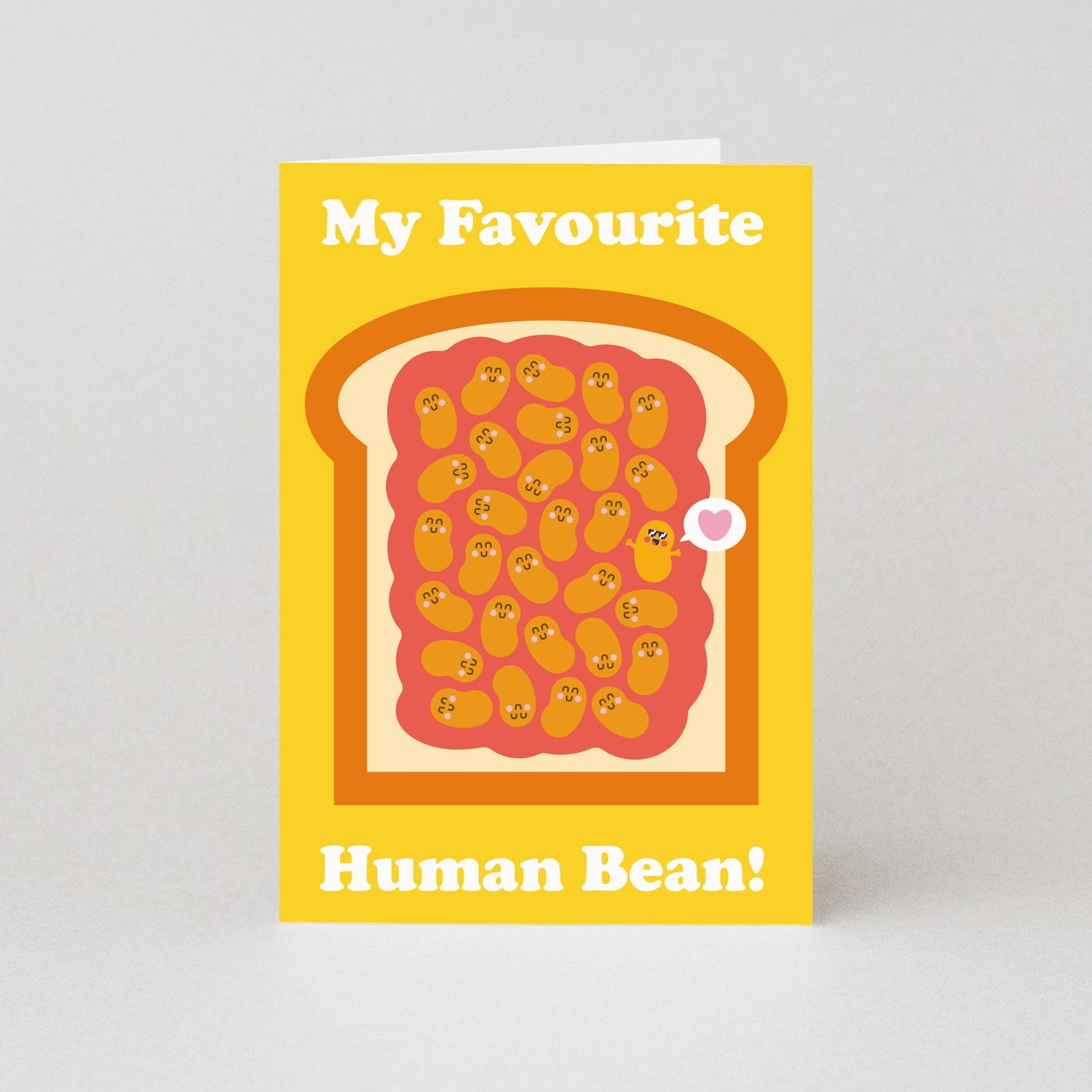 Card with toast and beans design on a yellow background