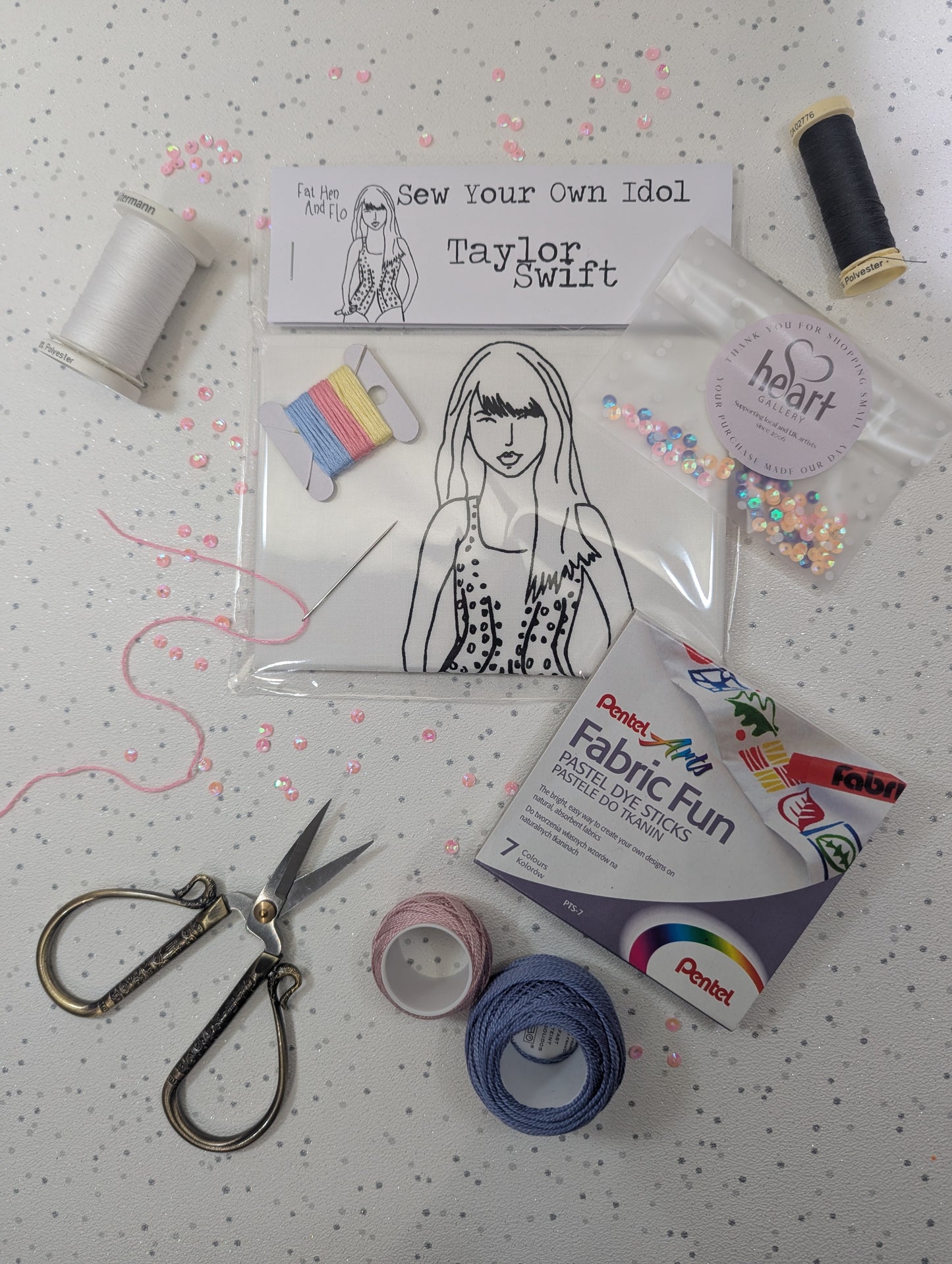 Sewing kit with materials and a Taylor Swift sew your own idol  on a polka dot background by Heart Gallery and Fat Hen and Flo