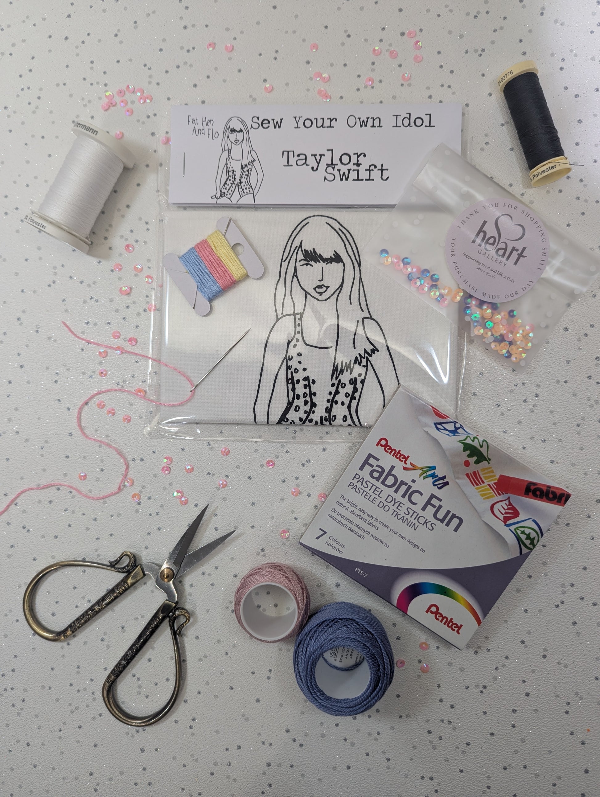 Sewing kit with materials and a Taylor Swift sew your own idol  on a polka dot background by Heart Gallery and Fat Hen and Flo
