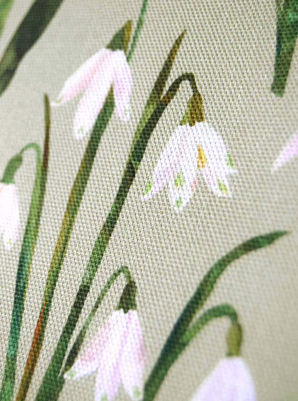 Close-up of a snowdrops tea towel by Freya Snow