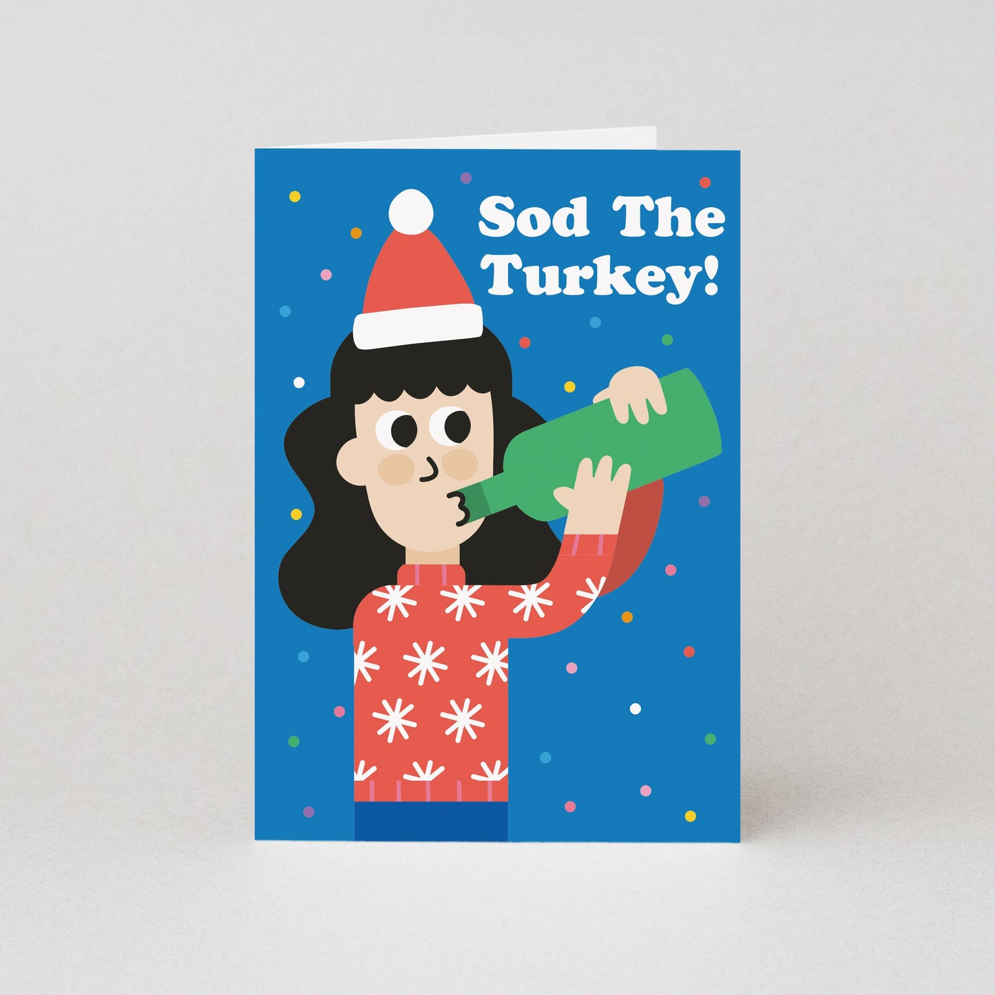 Card with illustration of a person wearing a Santa hat and holding a bottle, with text 'Sod The Turkey!' on a blue background.