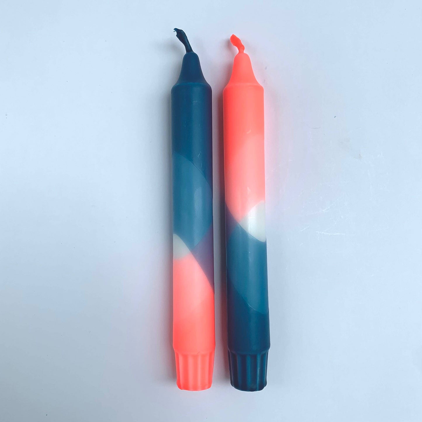 The Singing Rabbit candles in neon coral and teal blue