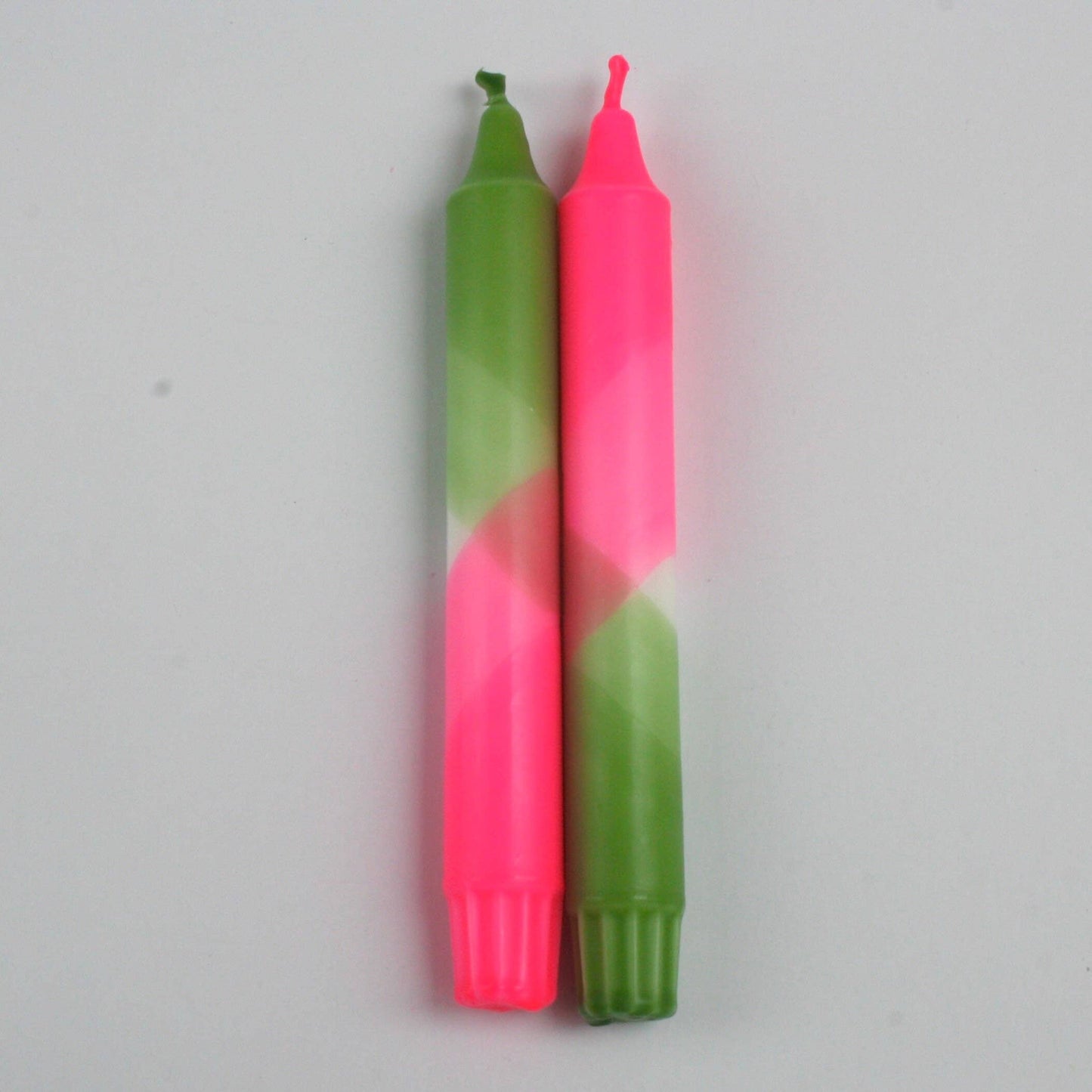 The Singing Rabbit neon pink and green pack of 2 candles hand dip dyed