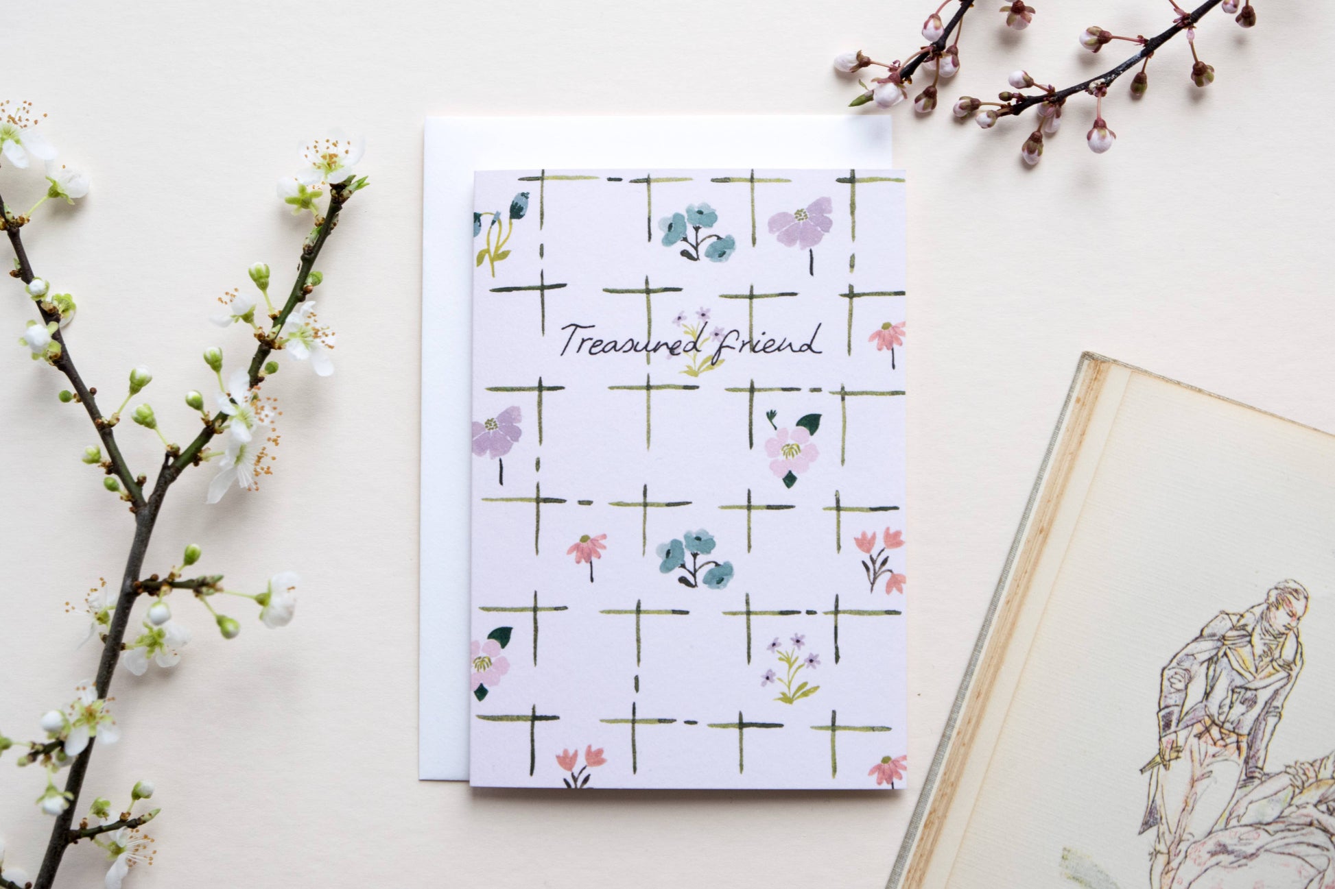 greetings card with floral design and 'Trusted Friend' text on a light background with decorative elements.