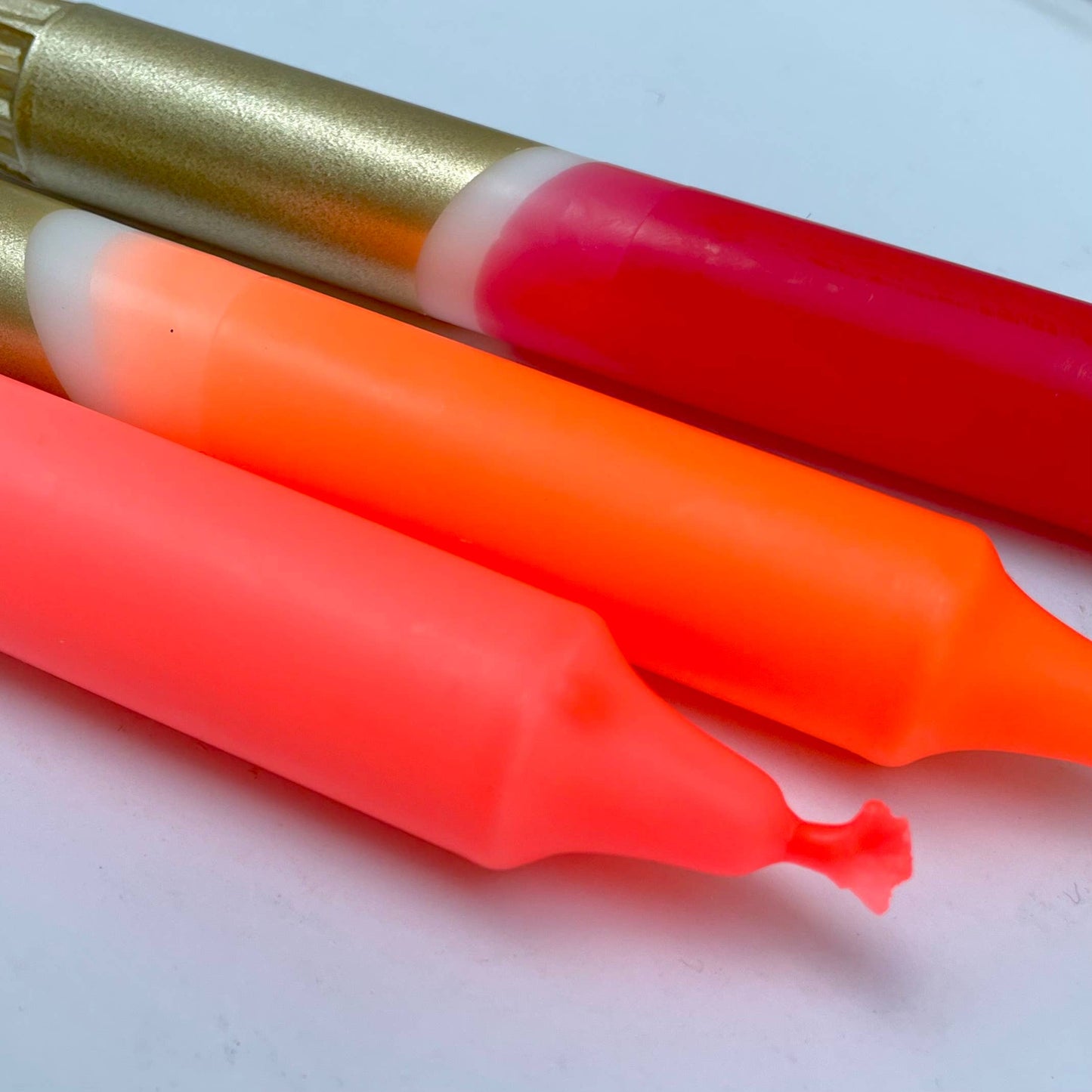 close up of 3 neon candles by The Singing Rabbit for Heart Gallery