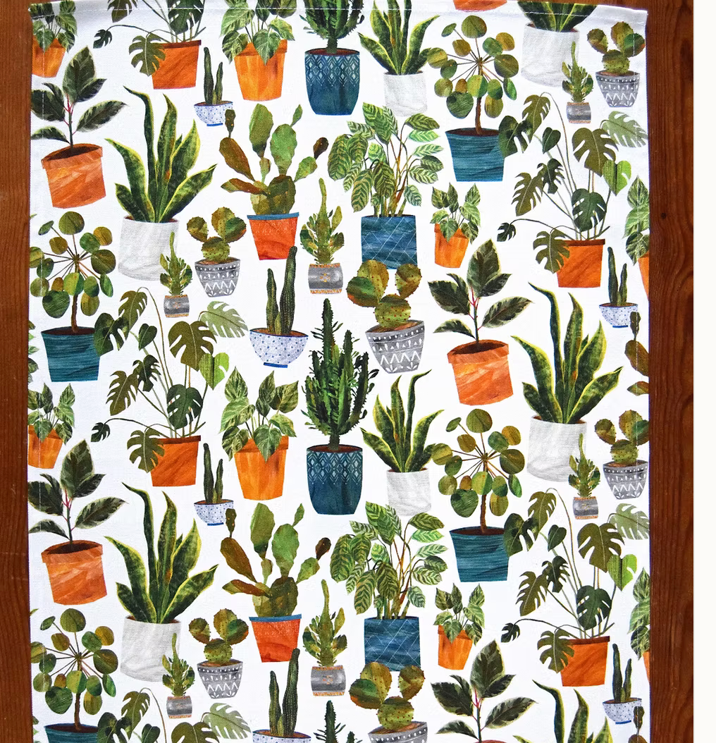 Tea towel by Freya snow with potted plants on a white background