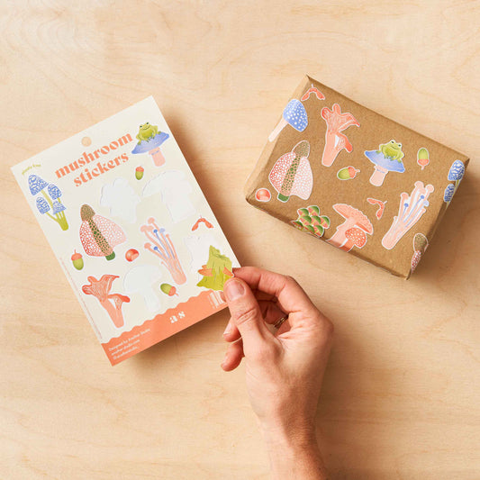 Another Studio mushroom stickers stuck on a small parcel