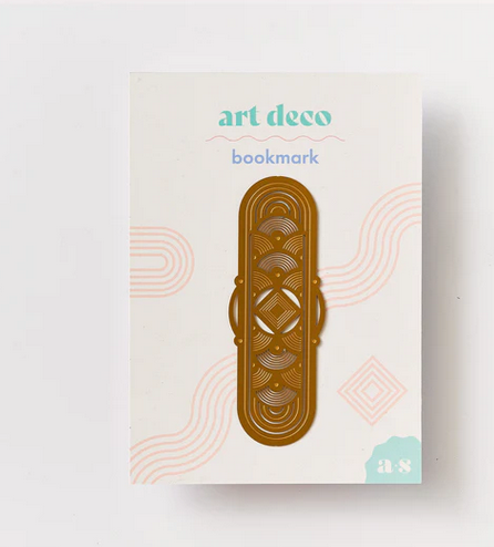 An Art Deco style brass-coated steel bookmark with geometric patterns, displayed on a white card with 'art deco bookmark' text.