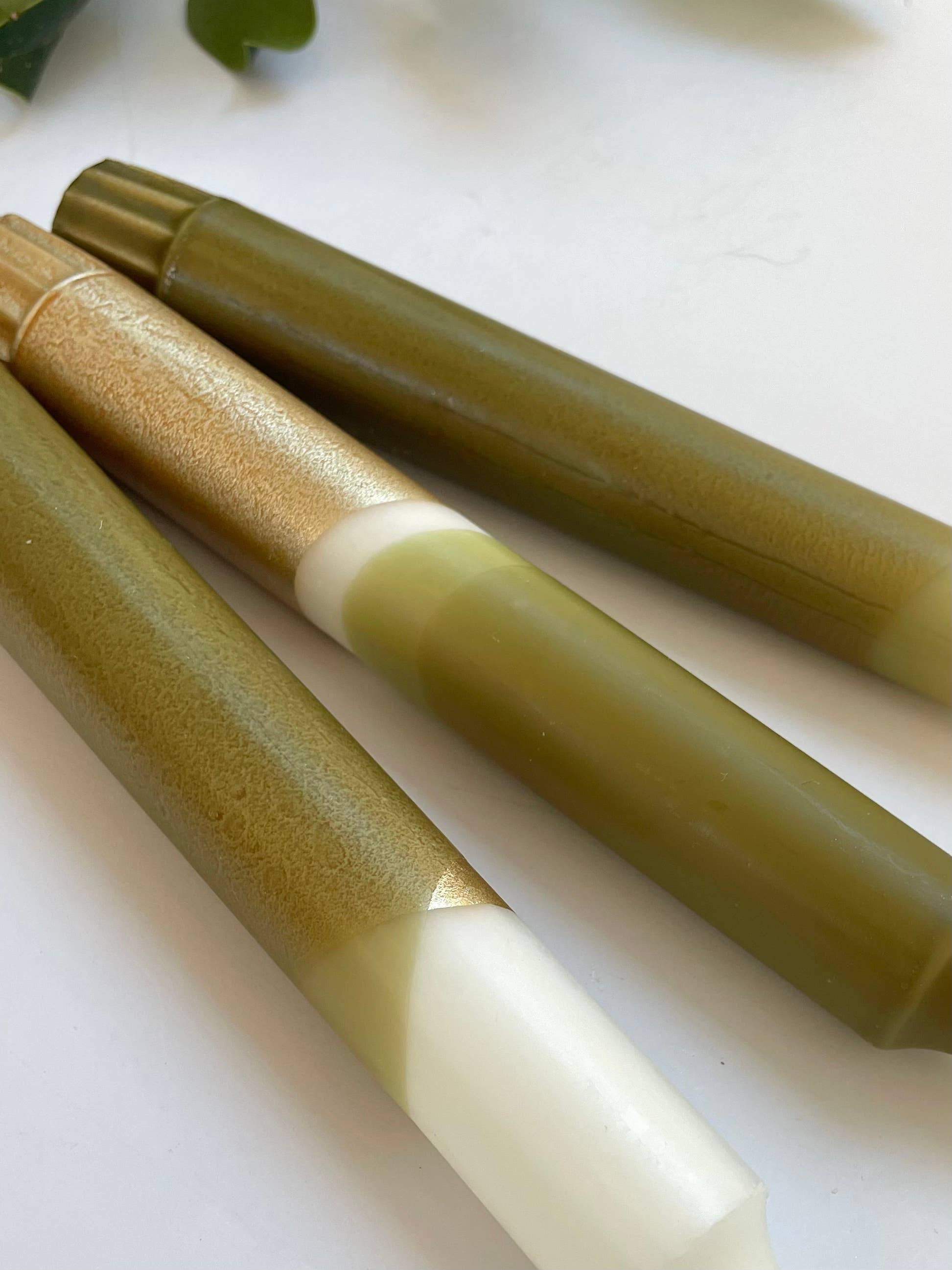 close up of 3 candles by The Singing Rabbit in olive green and gold