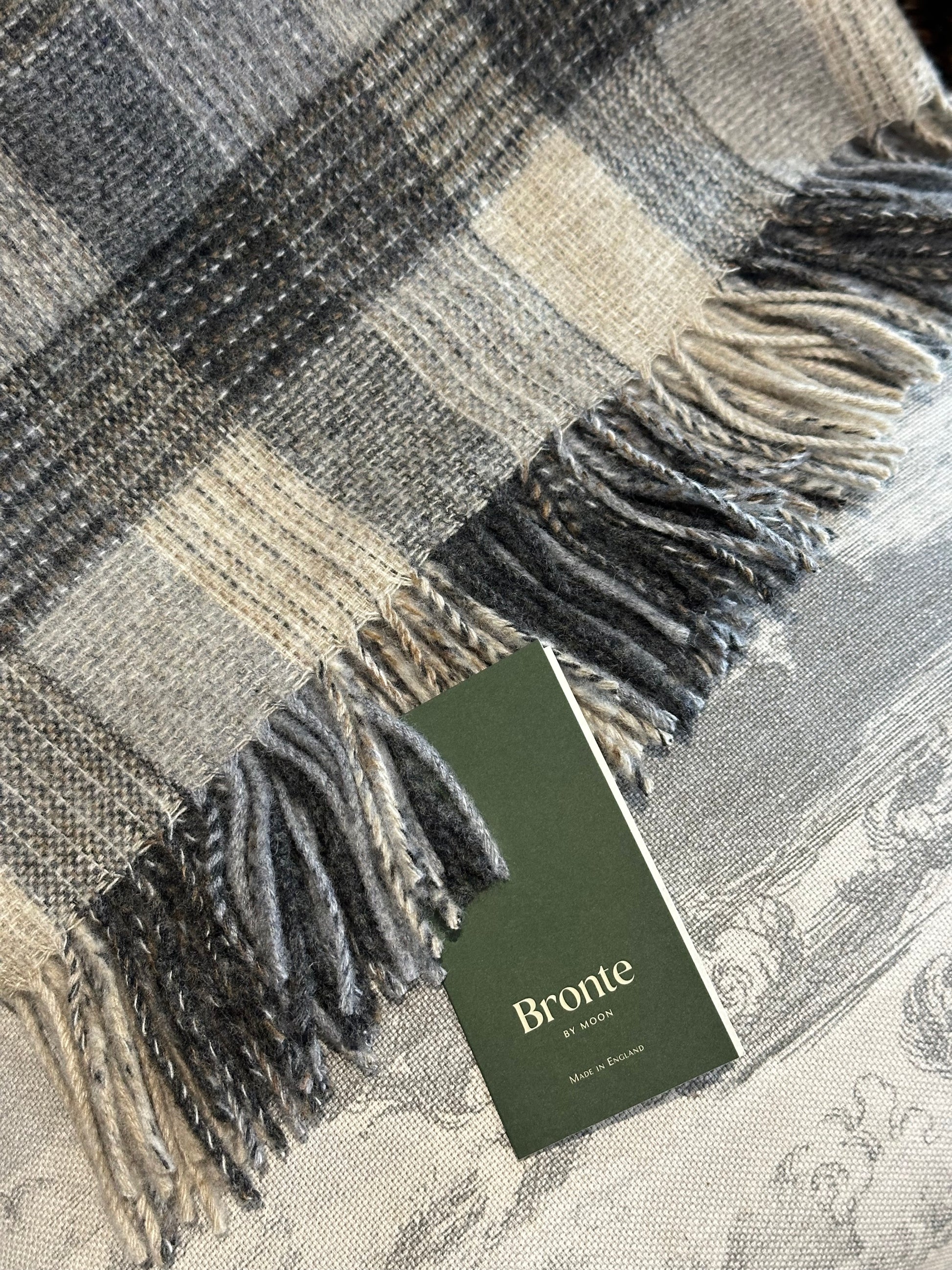 close up of Bronte Moon merino throw patchwork design in natural