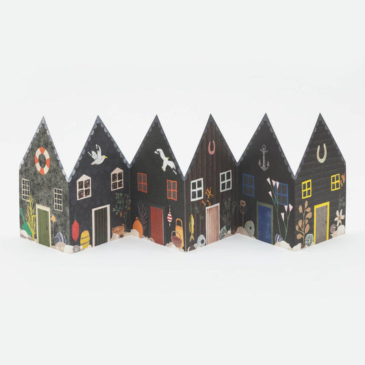 Decorative paper fisherman's hut car with various designs on a white background 