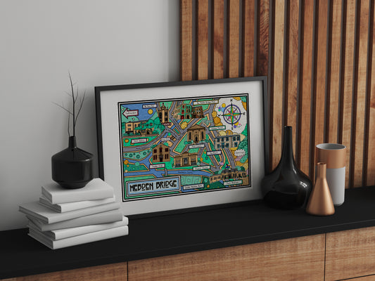 Framed map print by Lucy Parker for Heart Gallery on a shelf with decorative items