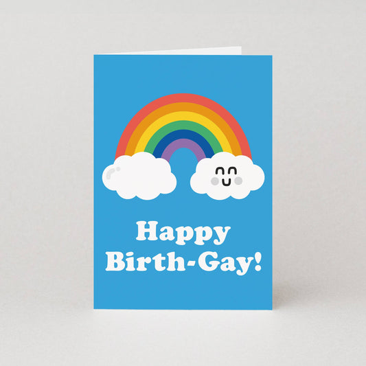 Card with rainbow and clouds on a blue background with 'Happy Birth-Gay!' text.