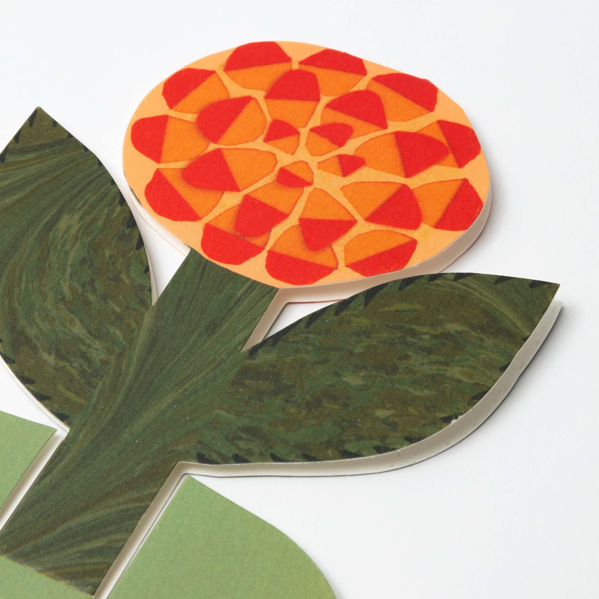 Decorative  card  with a leaf design and a green pattern on a white background