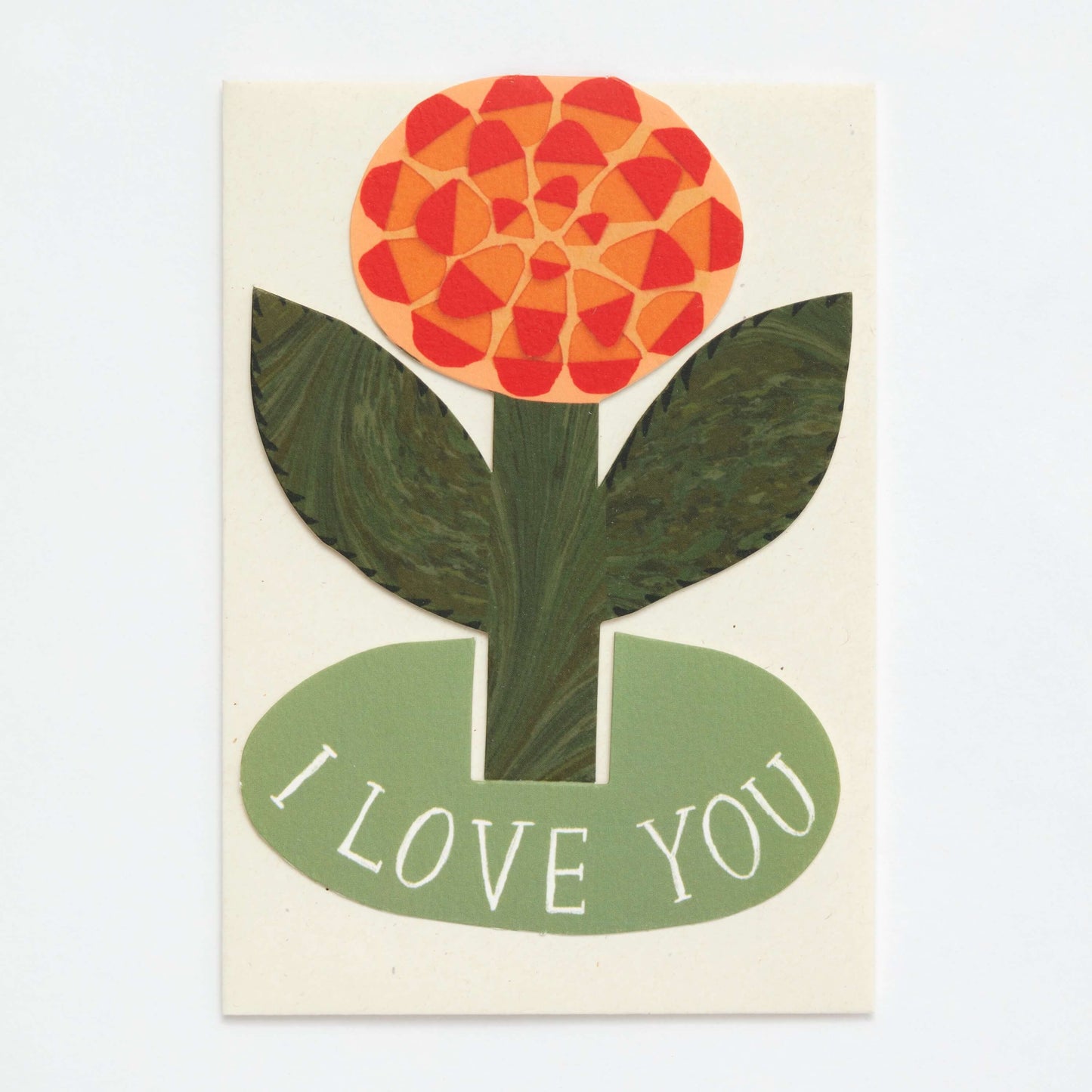 Card with a stylized flower design and 'I LOVE YOU' text on a beige background