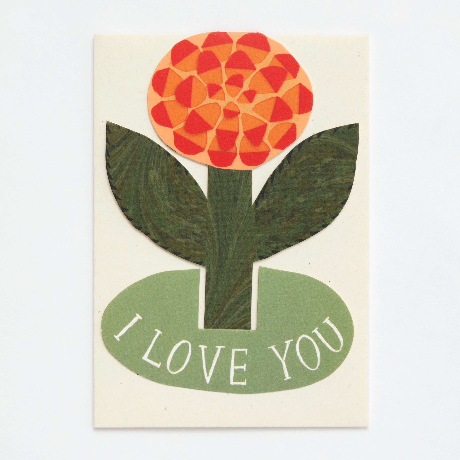 Card with a stylized flower design and 'I LOVE YOU' text on a beige background