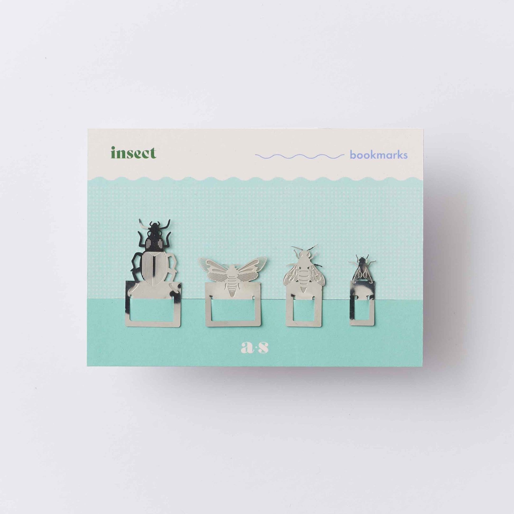 A set of metal page markers in the shapes of insects such as a moth and fly packaged ready for posting