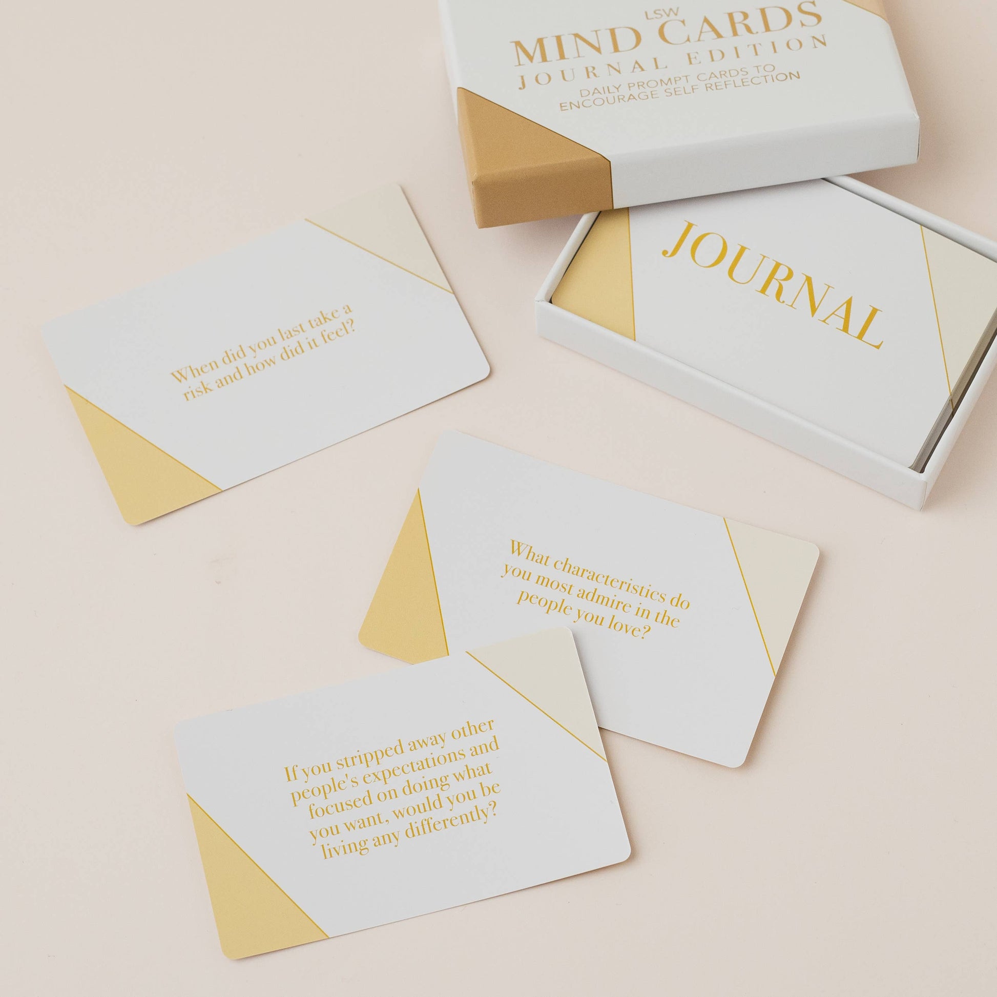 Set of cards with text and a box labeled 'Mind Cards Journal Edition' on a light background