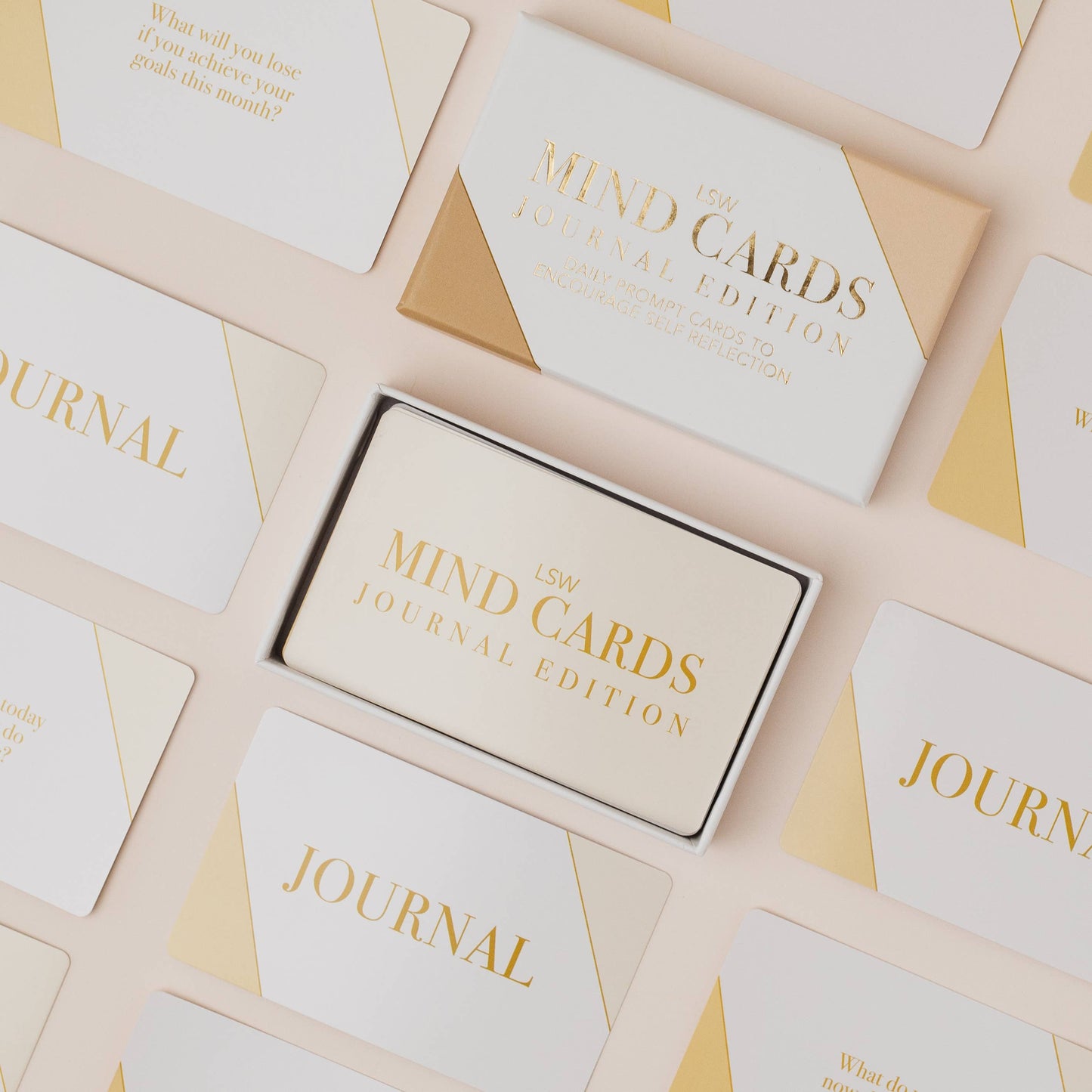 Set of 'Mind Cards' journal edition packaging on a beige background