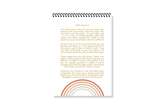 A white, wire-bound notebook with a pink cover featuring the title 'Worry Notes' in red text, along with a small decorative element on the top  right by LSW for Heart Gallery