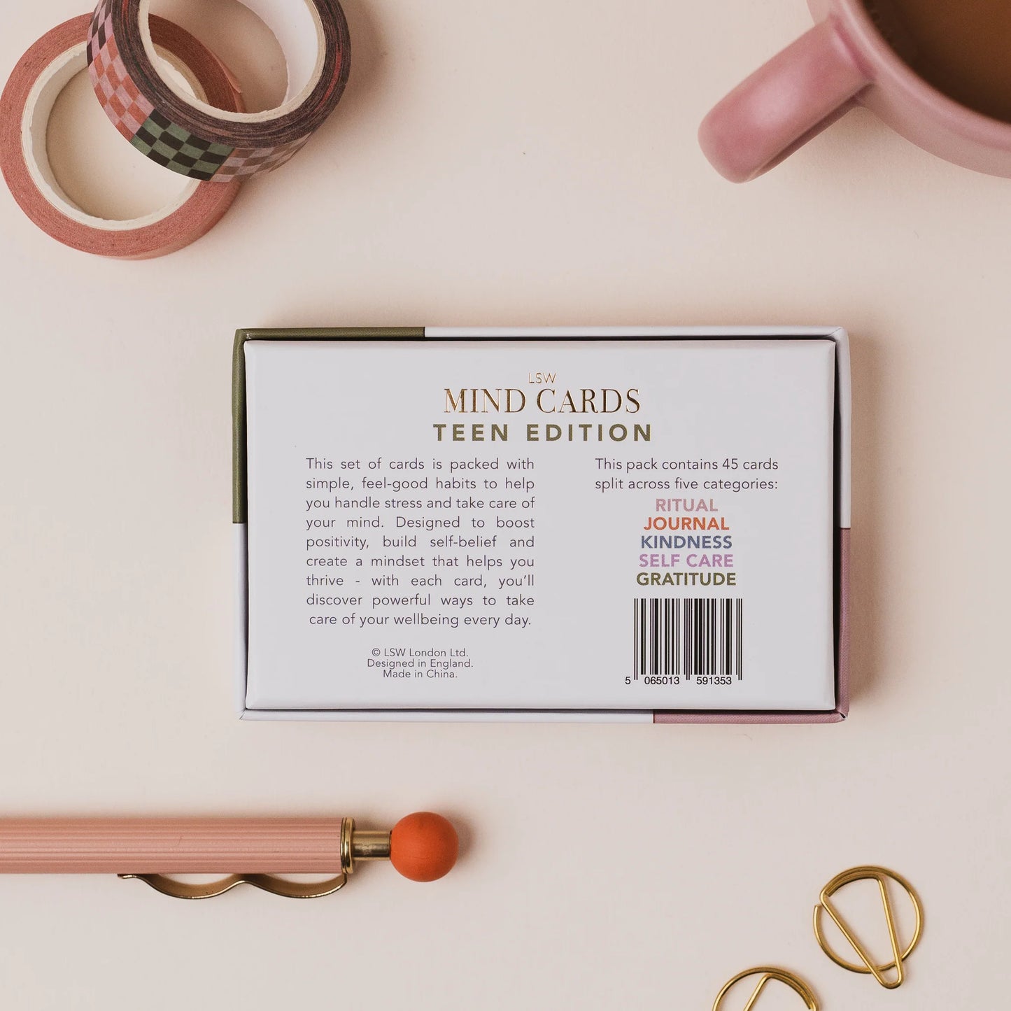 Box of 'MIND CARDS TEEN EDITION' on a light surface with stationery items.
