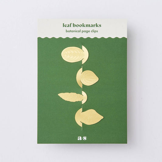 Packaging of a leaf bookmark set with four brass leaf clips on a green background, titled 'Leaf bookmarks botanical page clips' with the brand 'A-S' visible.