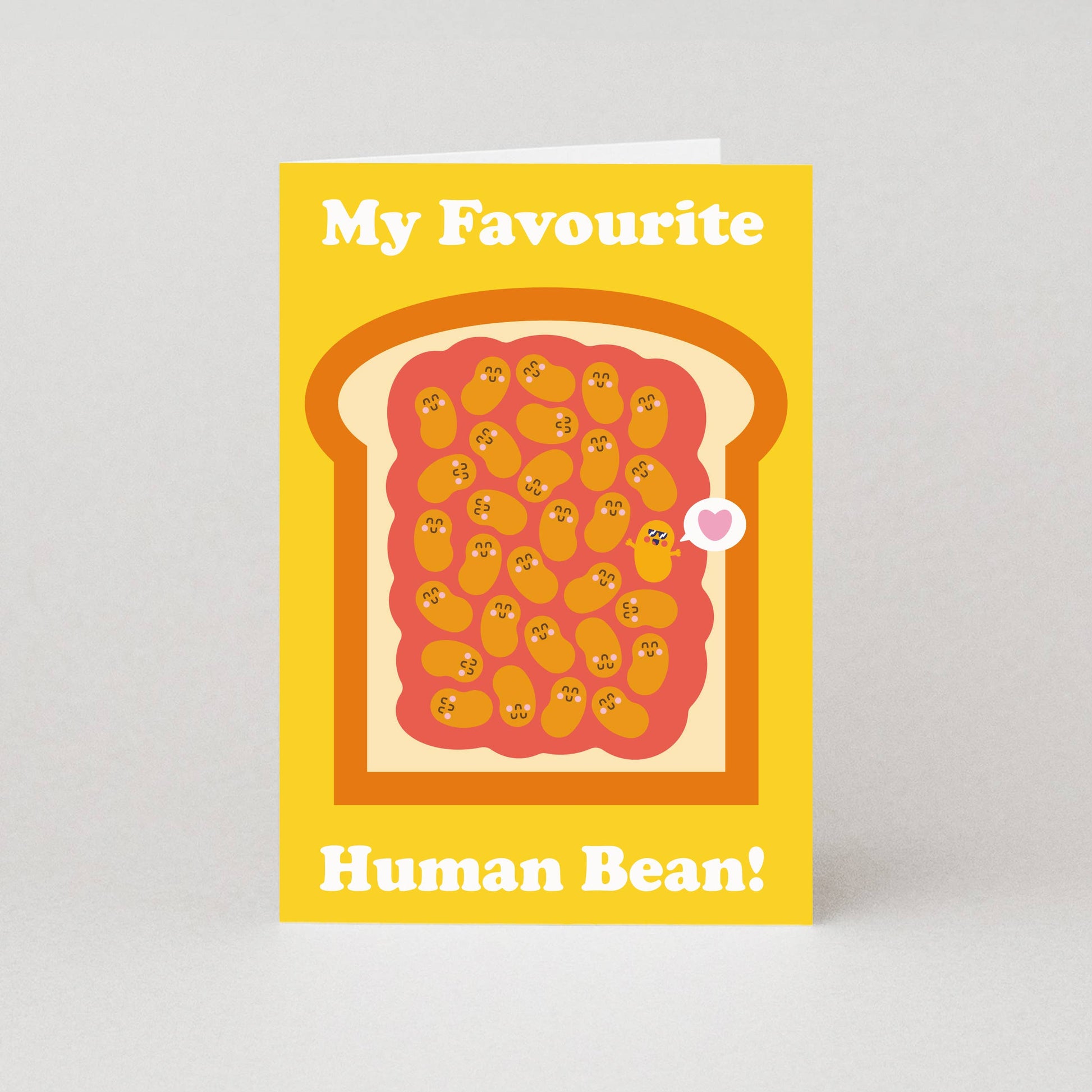 Card with toast and beans design on a yellow background