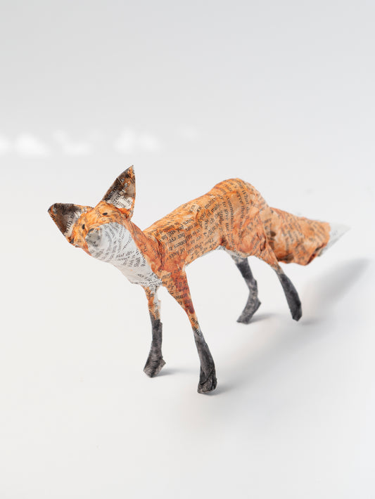 Paper mache fox figure on a white background by Diana Parkhouse for Heart Gallery
