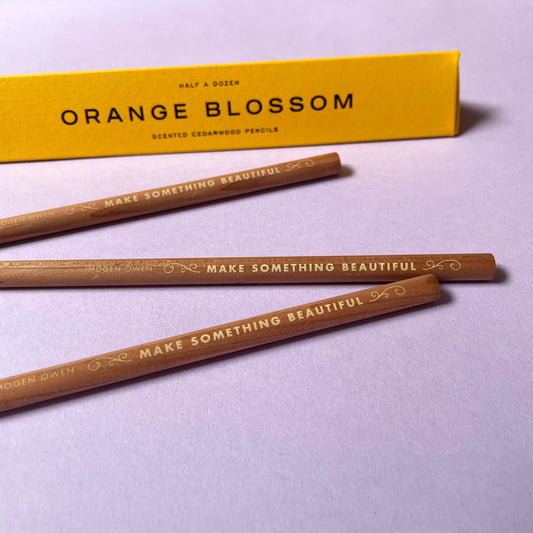 Scented cedarwood pencils with 'Orange Blossom' packaging on a light purple background set of 6 by Imogen Owen