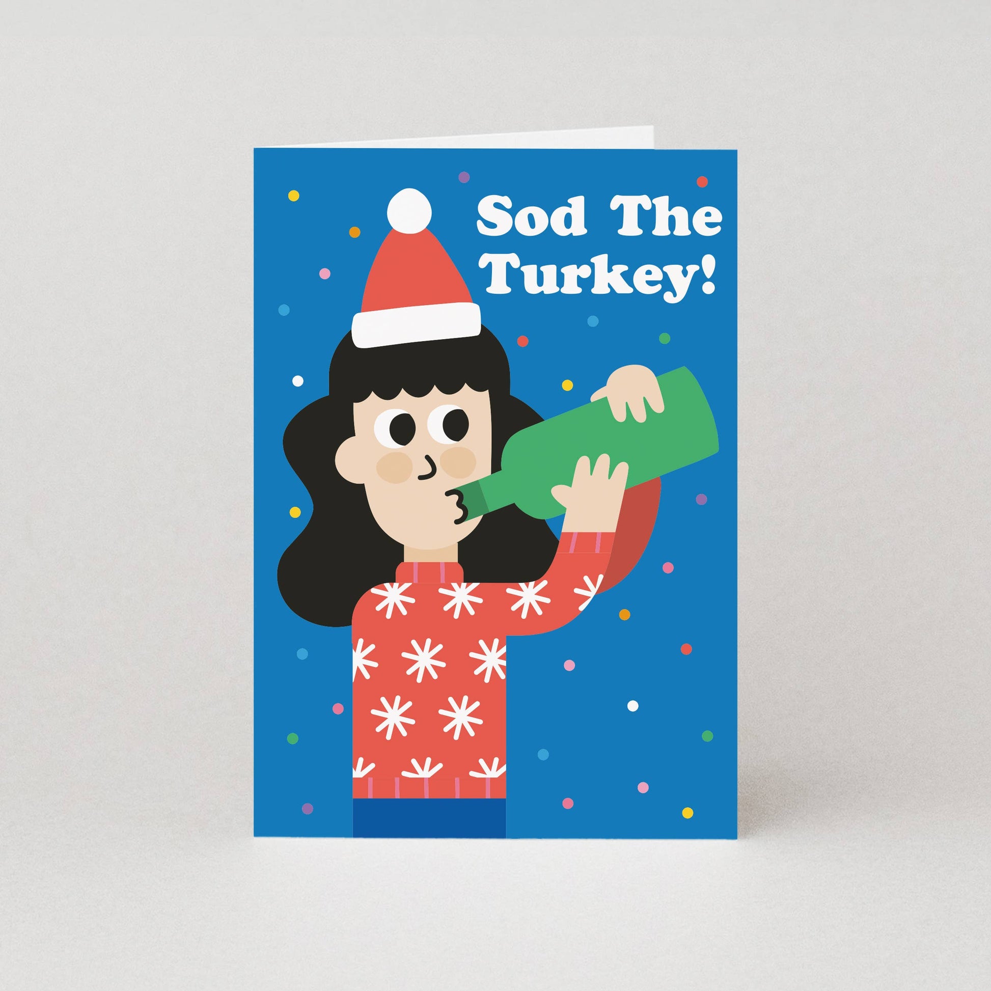Card with illustration of a person wearing a Santa hat and holding a bottle, with text 'Sod The Turkey!' on a blue background.