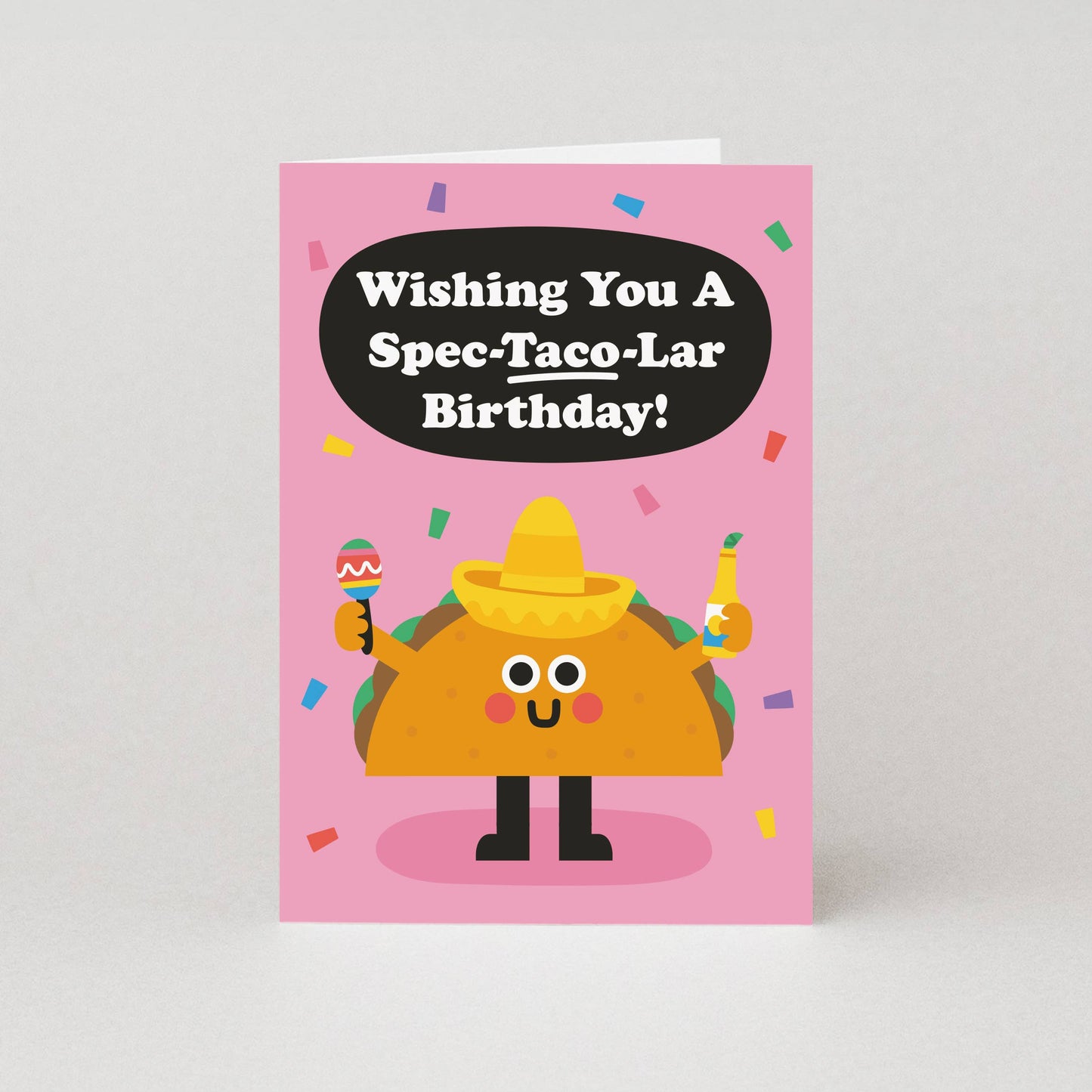 Birthday card with a cartoon taco character and humorous birthday message on a pink background