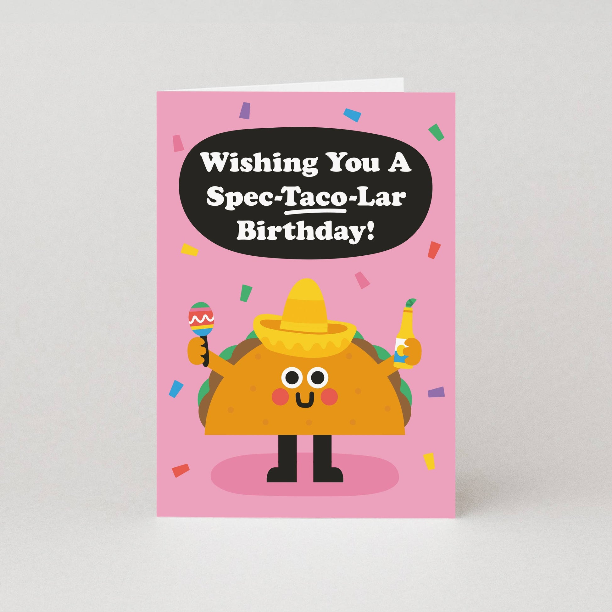 Birthday card with a cartoon taco character and humorous birthday message on a pink background