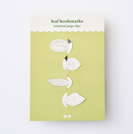 A set of stainless steel leaf bookmarks featuring four unique leaves, packaged on a card with 'Leaf bookmarks' written at the top.