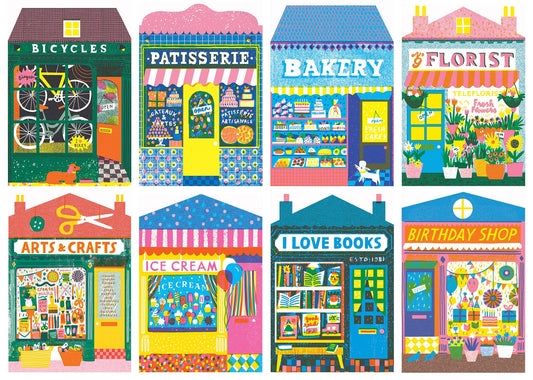 Illustrations of colorful store fronts including a bicycle shop, patisserie, bakery, florist, arts and crafts store, ice cream shop, bookshop, and birthday shop in a 1000 piece jigsaw