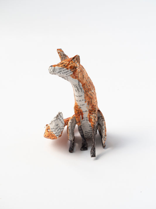 Paper mache fox sculpture on a white background by Diana Parkhouse for Heart Gallery