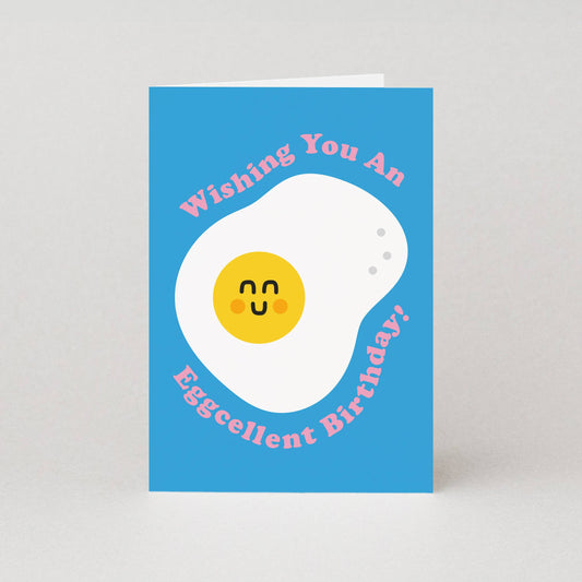 Greeting card with an egg illustration and text on a blue background